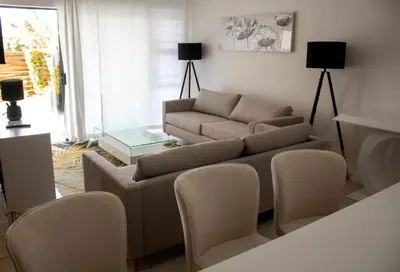a living room with a couch and chairs and a table at Time Oon Travel & Tour The Blyde in Pretoria