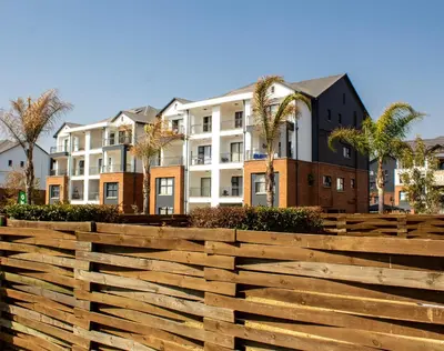 a wooden fence in front of a building at Time Oon Travel & Tour The Blyde in Pretoria