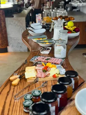 a long table with food on top at Honeyguide Conservation Lodge in Golders Green