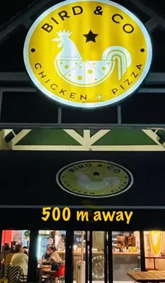 a sign for a restaurant with a clock on it at Apartments on Herbert Baker in Pretoria