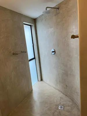 a bathroom with a shower with a glass door at Apartments on Herbert Baker in Pretoria