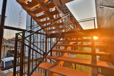 a wooden staircase in a building at Lowveld Vivid Haven in Boschrand