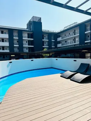 a swimming pool on the roof of a building at Luxury Studio Apartment next to Brooklyn Mall in Pretoria