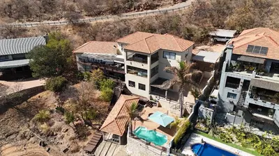 an aerial view of a house with a swimming pool at Khenjadji at Fish Eagle Bay in Warmbaths