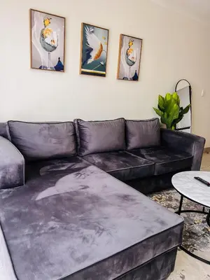 a living room with a black leather couch at Tetani's Luxury Oasis in Lakeside