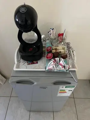 a coffee maker sitting on top of a machine at Kremetart Villa in Alldays