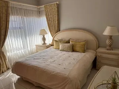 a bedroom with a large bed and a window at Pecanwood Holiday Home in Kosmos