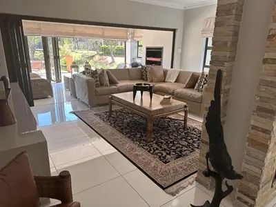 a living room with a couch and a coffee table at Pecanwood Holiday Home in Kosmos