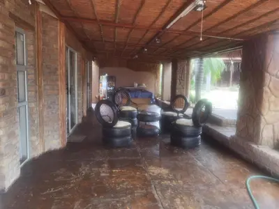 a room with a bunch of drums in a building at Bosveld Kuier Woonstel in Bela-Bela