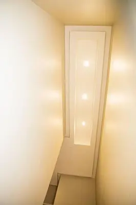 a small hallway with a white door and a staircase at Hatfield on Park A in Pretoria