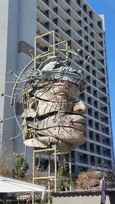 a large building with a sculpture of a beached at When Away - Your Home Away from Home in Pretoria