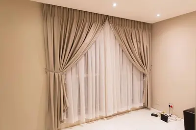 a large window with curtains in a room at Hatfield on Park B in Pretoria