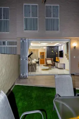 a view of a living room with green grass at Hatfield on Park B in Pretoria