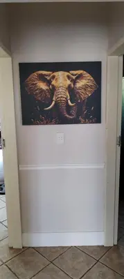 a picture of an elephant on a wall at Pearlman Loft in Tzaneen