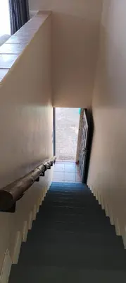 a stairway leading up to a building with a hallway at Pearlman Loft in Tzaneen