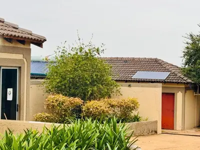 a house with a solar panel on top of it at Soaring Summit Lodge in Ronaldsey