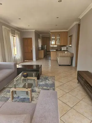 a living room with a couch and a table at Feel at Home in Monavoni
