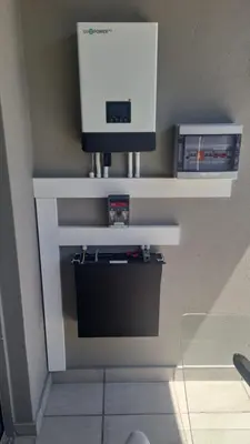 a white shelf with a tv on a wall at Moon Octave in Midrand