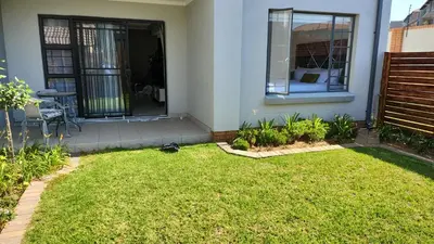 a house with a lawn in front of a house at Moon Octave in Midrand