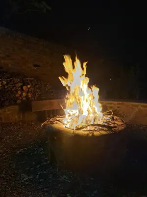 a fire pit is lit up at night at Casa Mana Air B&B in Pretoria