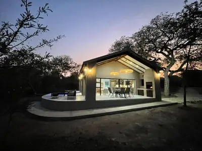 a small house with a porch and a patio at Shomoro Rest in Marloth Park