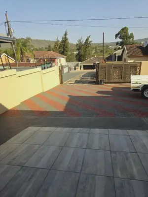 an empty parking lot with a truck parked on the street at SammyGrace Holiday Home in Tzaneen