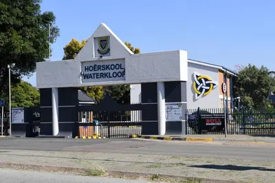 a building with a sign on the side of a street at Harmony Suite in Pretoria