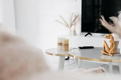a living room with a table and a tv at The Blyde Crystal Villa Apartment in Pretoria