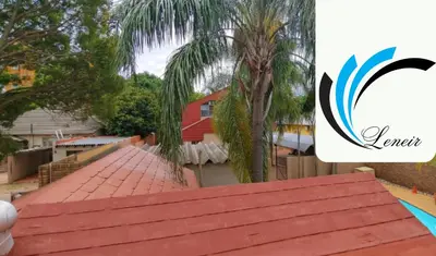 a view from the roof of a house with a palm tree at Leneir in Pretoria