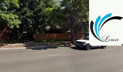 a car parked on the side of a street at Leneir in Pretoria