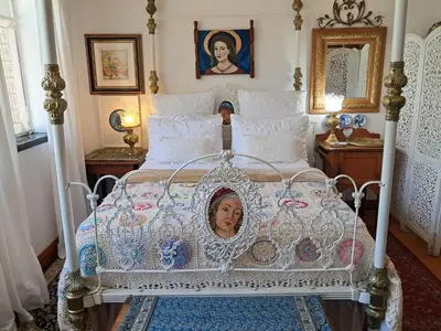 a bed with a picture of a woman on it at 29onTait Guest House in Pretoria