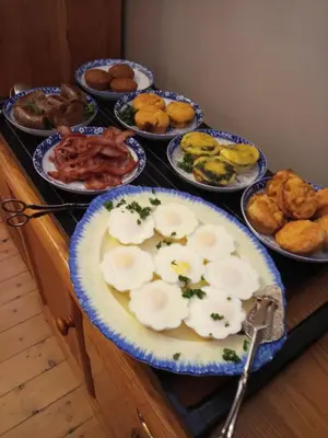 a table topped with plates of food on a table at 29onTait Guest House in Pretoria