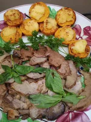 a plate of food with meat and potatoes on it at 29onTait Guest House in Pretoria