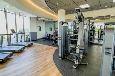 a gym with treadmills and machines in a room at Beautiful Galena at Ellipse in Midrand