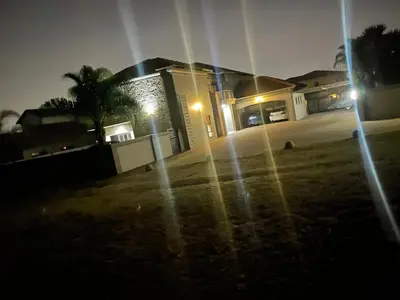 a house at night with lights in the yard at Villa De Gabe in Monavoni
