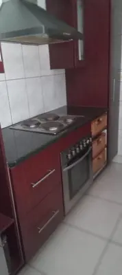 a kitchen with a stove and a stove top oven at View in in Nelspruit