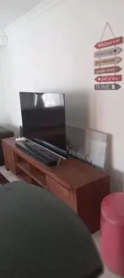 a wooden table with a television on top of it at View in in Nelspruit