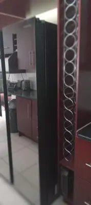 a view of a kitchen with a cupboard with dishes at View in in Nelspruit