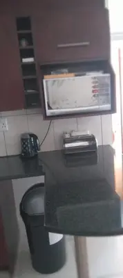 a kitchen with a counter top with a microwave at View in in Nelspruit
