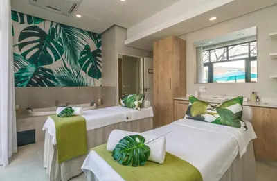 a room with two beds and a mirror at The River-view in Midrand