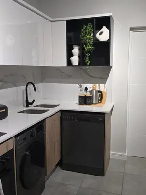 a kitchen with a sink and a dishwasher at The River-view in Midrand