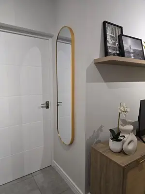 a bathroom with a mirror and a wooden table at The River-view in Midrand