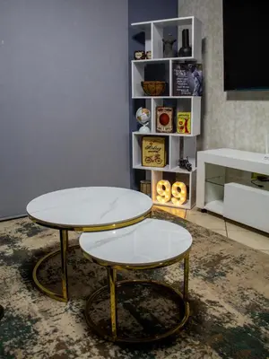 a table and two stools in a room at Time Oon-Travel & Tour Equestria Parkview in Pretoria