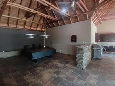 a large room with a ping pong table in it at Zebula Golf and Wildlife Estate - Bushveld Bliss Pax 14 - Moi Signature Luxury villa in Mabula