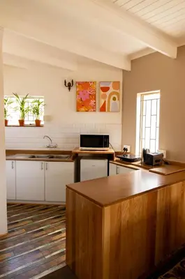 a kitchen with a sink and a counter top at Camellia Luxury Apartment in Pretoria
