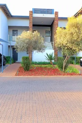 a brick driveway in front of a building at The Thorn by the airport in Kempton Park