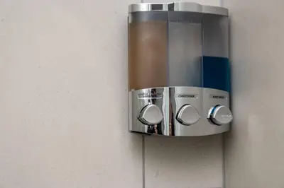 a paper towel dispenser hanging on a wall at 2 Bed Luxury Apartment, Ellipse, Waterfall in Midrand