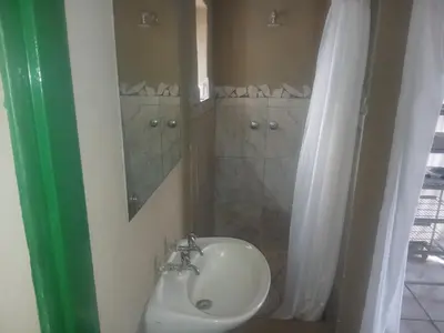 a bathroom with a sink and a mirror at Mbaula lodge in Letaba Wildlife Reserve