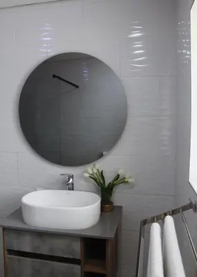 a bathroom with a sink and a large mirror at Kingdoms Lodge in Groblersdal