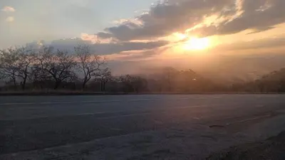 an empty road with the sunset in the background at Makhonjwa Rose Barberton in Barberton